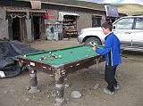 Tibet Kailash 08 Kora 07 Darchen Playing Pool Pete and I walked outside and enjoyed a few games of pool as Tibetans looked on. They especially cheered when Pete made a great shot. The next morning Pete remarked, When I woke up I thought I was in my own bed. But then I realized, Oh crap, Im in Darchen .